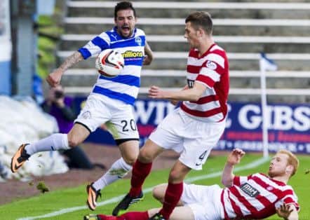 Nacho Novo, left is closed down by Hamilton pair Michael Devlin and Ziggy Gordon, below right. Picture: SNS