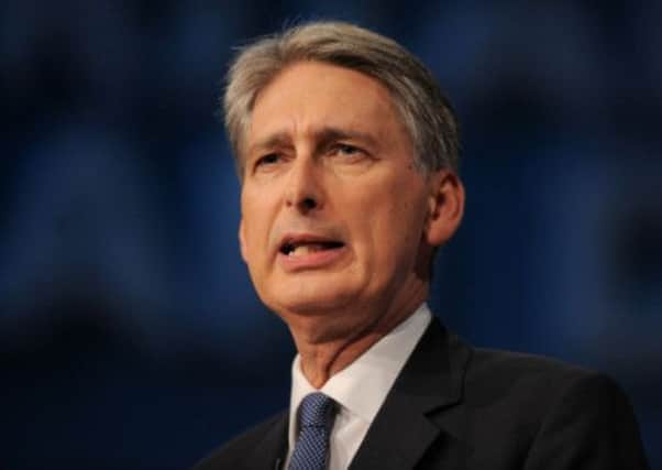 Philip Hammond has hit back at critics over cuts. Picture: Getty