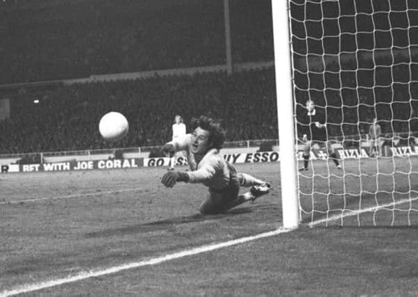 Polish goalkeeper Jan Tomaszewski makes one of several great saves at Wembley in 1973 to deny England a place in the World Cup finals. Picture: PA