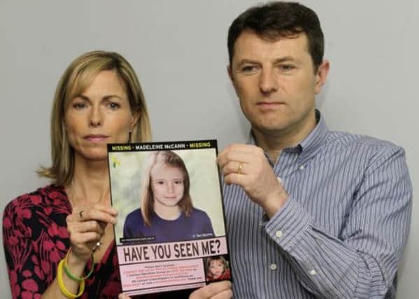 Parents Kate and Jerry with a poster showing Madeline McCann as she may look now. Picture: AP