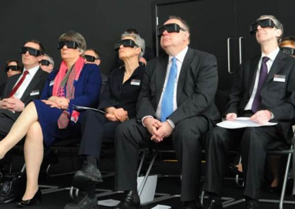 Alex Salmond, centre, takes in a 3D film with a pair of glasses - but according to new research, seeing in 3D only requires a single eye. Picture: Robert Perry