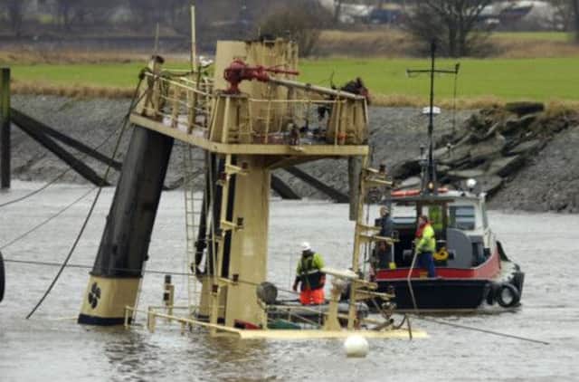 Salvage crew prepare to raise the Flying Phantom from the river bed in 2008. Picture: Donald Macleod