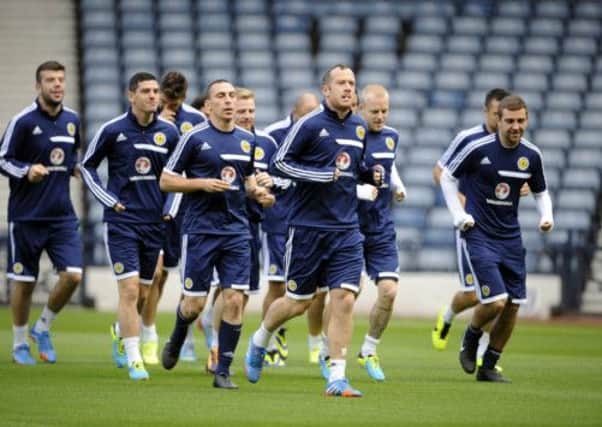 Scott Brown and Charlie Adam lead the squad in training at Hamdpen today. Picture: Greg Macvean