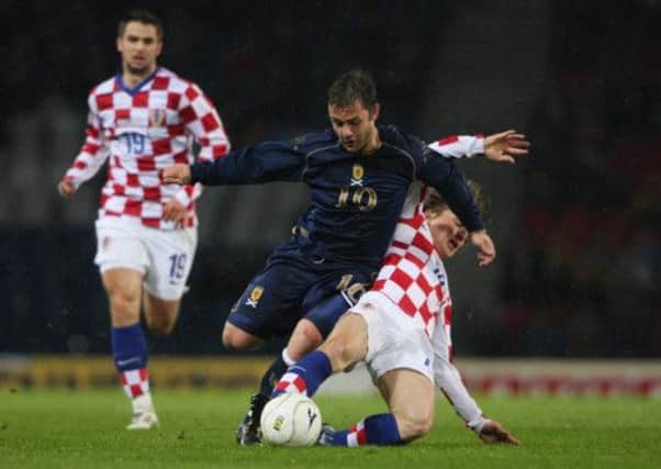 Shaun Maloney is tackled by Luka Modric during the 2008 clash. Picture: Getty