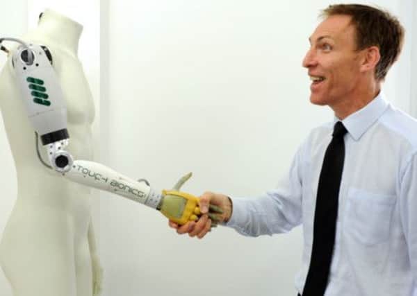 Jim Murphy, then secretary of State for Scotland, met BioQuarter success the i-Limb. Picture: Phil Wilkinson