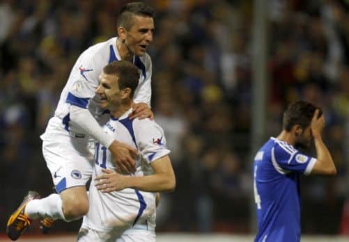 Vedad Ibisevic, left, celebrates with Edin Dzeko. Picture: Reuters