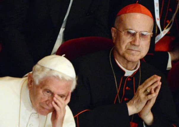 Former Vatican State Secretary Cardinal Bertone, pictured with former Pope Benedict XVI. Picture: AFP