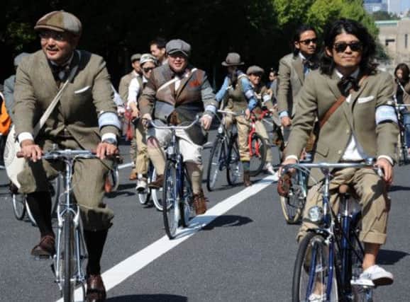 A tweed-themed bicycle ride around Tokyo at Japan Fashion Week. Picture: AFP/Getty