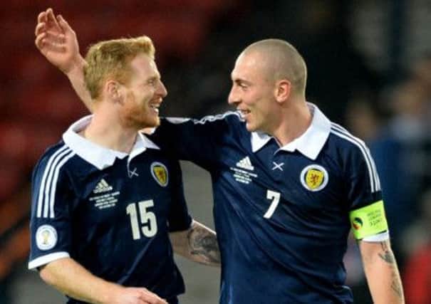 Club atmosphere: Scotland pair Chris Burke (left) and Scott Brown celebrate at full-time. Picture: SNS