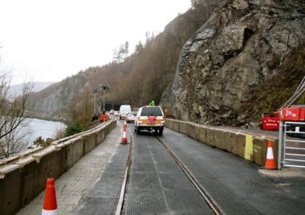 Highland Council workers at the site of a landslip earlier in 2013. Picture: Highland Council