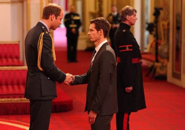 Andy Murray receives his OBE. Picture: PA