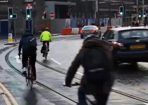 A cyclist in Edinburgh's West End moments before the fall. Picture: Youtube/Chris Hill