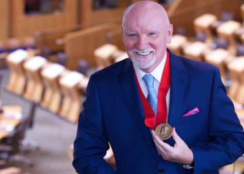 Tom Hunter has been awarded for his philanthropy at the Scottish Parliament. Picture: Joey Kelly