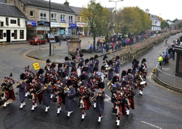 Soldiers from the Royal Highland Fusiliers, 2nd Battallion The Royal Regiment of Scotland march through Penicuik. Picture: Phil Wilkinson