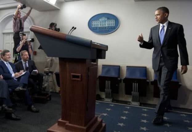 Barack Obama arrives to speak about the government shutdown and debt ceiling standoff. Picture: Getty