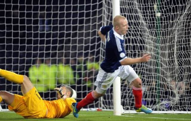 Steven Naismith scores against Croatia in Scotland's 2 - 0 win. Picture: TSPL