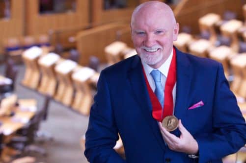 Sir Tom Hinter his award. Picture: submitted