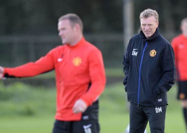 David Moyes, pictured with Wayne Rooney at a training session, tried to convince the then 16-year-old England striker to play for Scotland. Picture: PA