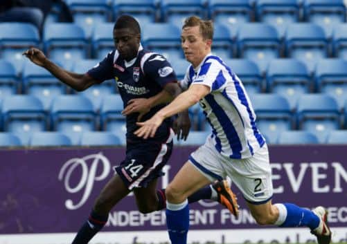 Kilmarnock's Jerone Tesselaar and Ross County's Darren Maatsen race for possession. Picture: SNS