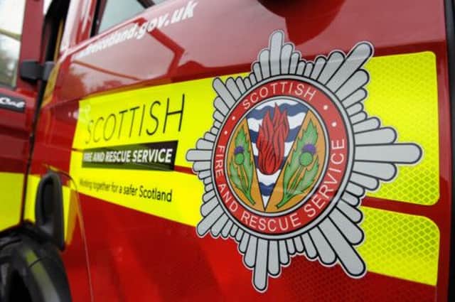 Seven fire appliances, police and the Scottish SPCA were involved in the rescue of Midge the spaniel. Picture: Michael Gillen