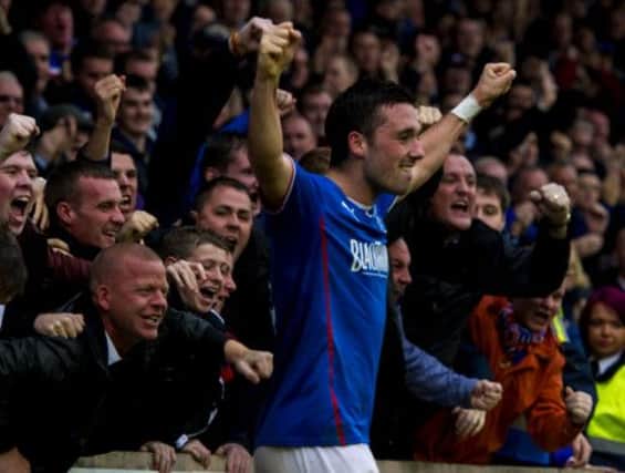 Nicky Clark celebrates with the Rangers supporters after his late winner completed a dramatic comeback against Brechin. Picture: SNS