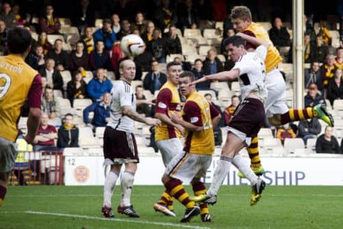 Shaun Hutchison manages to rise above the Hearts' defence to score Motherwell's winner at Fir Park on Saturday Picture: SNS