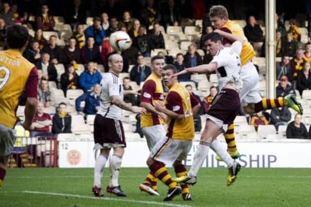 Shaun Hutchison manages to rise above the Hearts' defence to score Motherwell's winner at Fir Park on Saturday  Picture: SNS