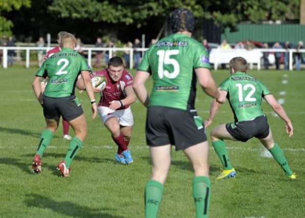 Gala's Rory Sutherland faces the daunting prospect of trying to fight through a wall of greenclad Leeds players during his sides thrashing in York. Picture: Rob Gray