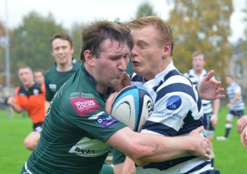 Heriots Max Nimmo and Hawick's Lee Armstrong go headtohead as Nimmo tries to break away. Picture: Jon Savage
