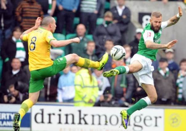 Celtic captain Scott Brown and Hibernian's Rowan Vine challenge for the ball during Saturday's 1-1 draw. Picture: Ian Rutherford