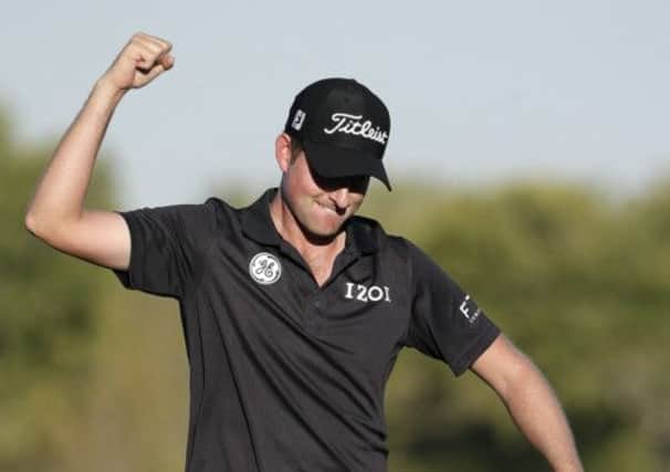 Webb Simpson shows what it means to clinch his first win since the 2012 US Open. Picture: Julie Jacobson/AP