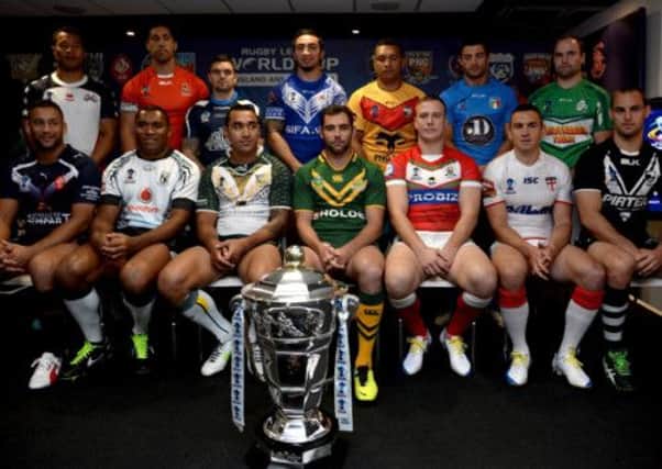 Players representing the 14 nations competing for the Rugby League World Cup gather at Old Trafford yesterday. Picture: Getty