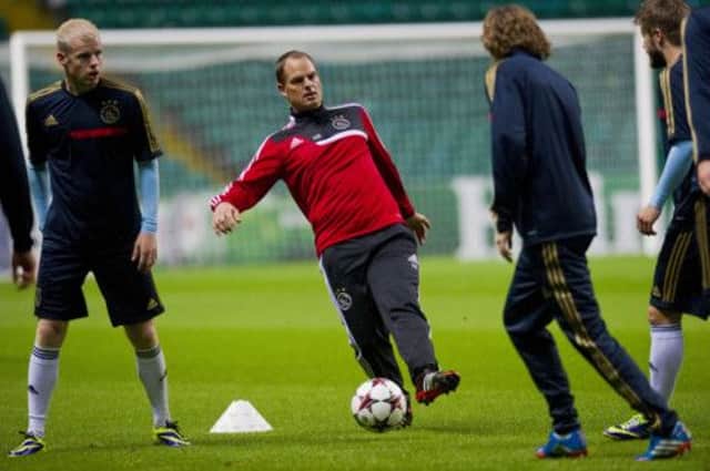 Ajax manager Ronald de Boer shows his young squad how its done at Celtic Park last night. Picture: SNS