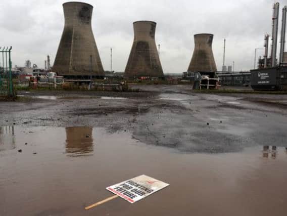 A Unite placard lies in a puddle outside Grangemouth refinery. Picture: Ian Rutherford