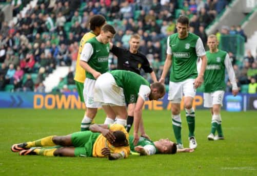 Amido Balde and Michael Nelson are grounded after a clash of heads. Picture: SNS