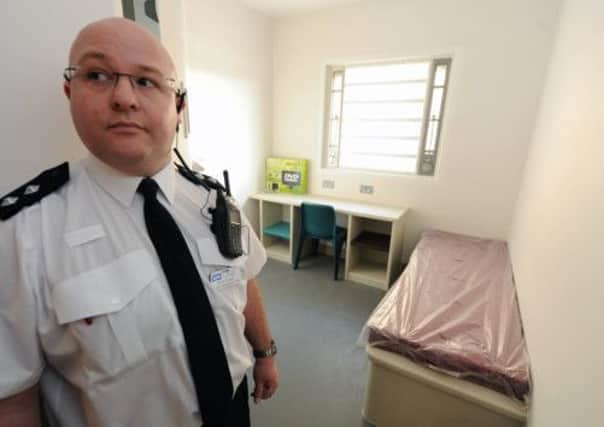 A prison officer checks one of the accommodation rooms at Low Moss. Picture: Ian Rutherford