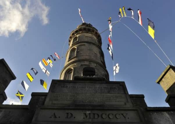 Flags fly from the Nelson Monument. Picture: Ian Rutherford