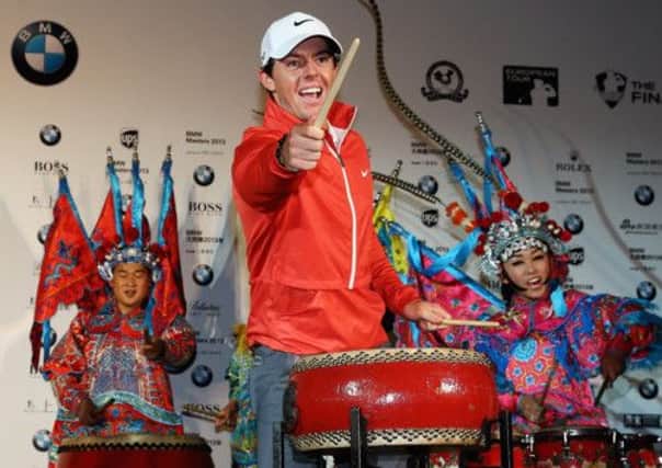 Rory McIlroy plays a Chinese drum yesterday at an event to promote this weeks BMW Masters in Shanghai. Picture: Getty