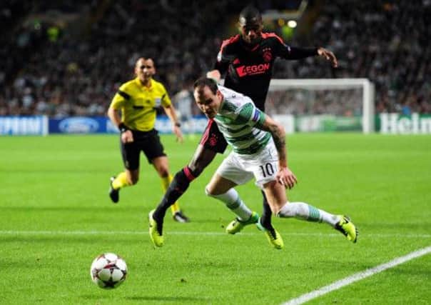 Anthony Stokes is brought down inside the 18-yard box by Ajaxs Stefano Denswil. Picture: Ian Rutherford