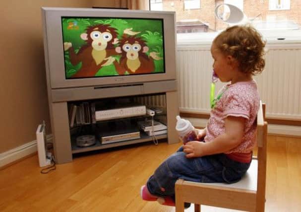 Scottish children spend four hours a day screen-bound. Picture: PA