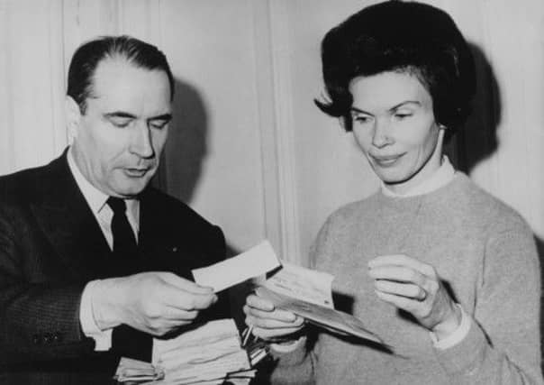 Mitterrand with his wife Danielle read congratulatory cables at their home, during the first round of the presidential election in 1965. Picture: Getty