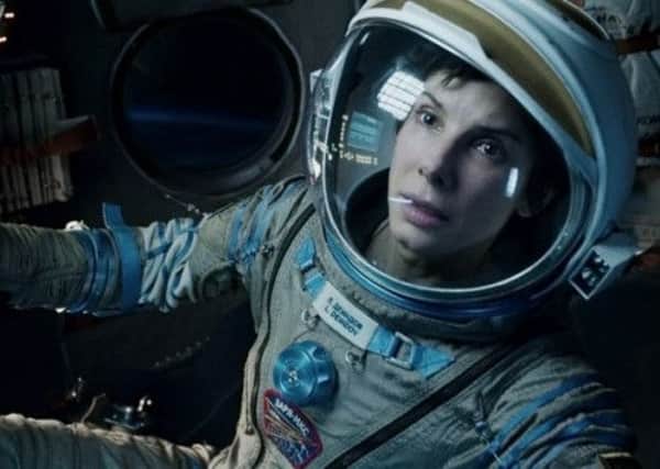 Sandra Bullock stars alongside George Clooney in 'Gravity'. Picture: Contributed