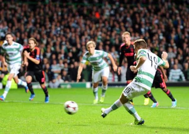 James Forrest scores from the penalty spot to give Celtic the lead against Ajax. Pic Ian Rutherford