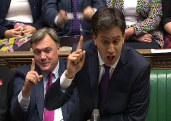 Shadow chancellor Ed Balls and Labour leader Ed Miliband attack the Prime Minister in the Commons yesterday. Picture: PA