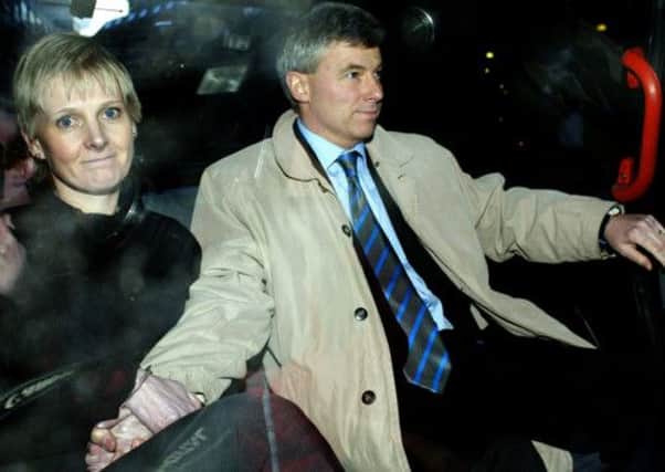 Sally Clark leaves court with husband Stephen after winning an appeal against her conviction for the murder of her two sons. Picture: Reuters