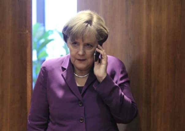 A White House spokesman said Mr Obama had assured Mrs Merkel that the US 'is not monitoring and will not monitor' her communications. Picture: Reuters