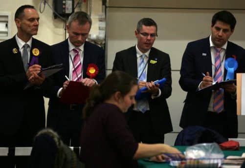 Party workers checking the count at the election count for the Dunfirmline by-election. Picture: PA