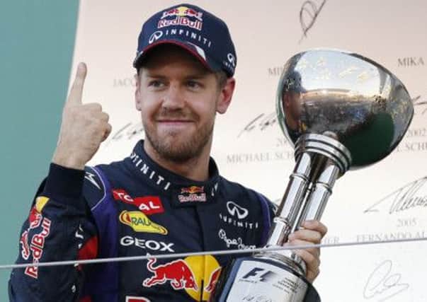 Vettel with the Japanese Grand Prix trophy he won two weeks ago. Picture: AP