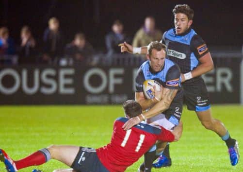 Byron McGuigan  is challenged by Munster's Ronan O'Mahony. Picture: SNS