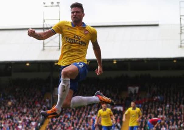 Arsenal's Olivier Giroud jumps for joy after nodding home his side's second against Palace. Picture: Getty